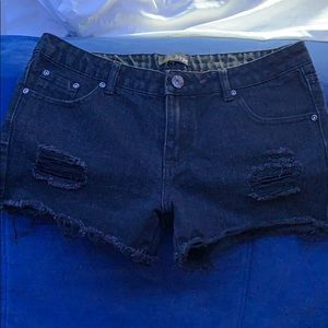 Black distressed booty shorts